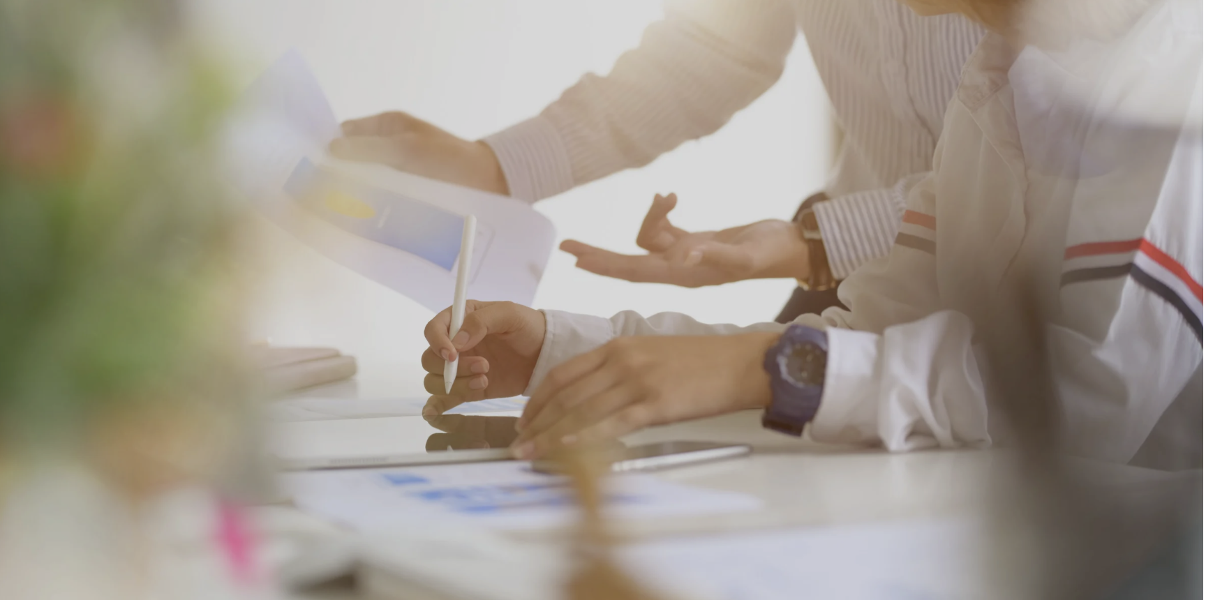 Hands over desk appearing to be working