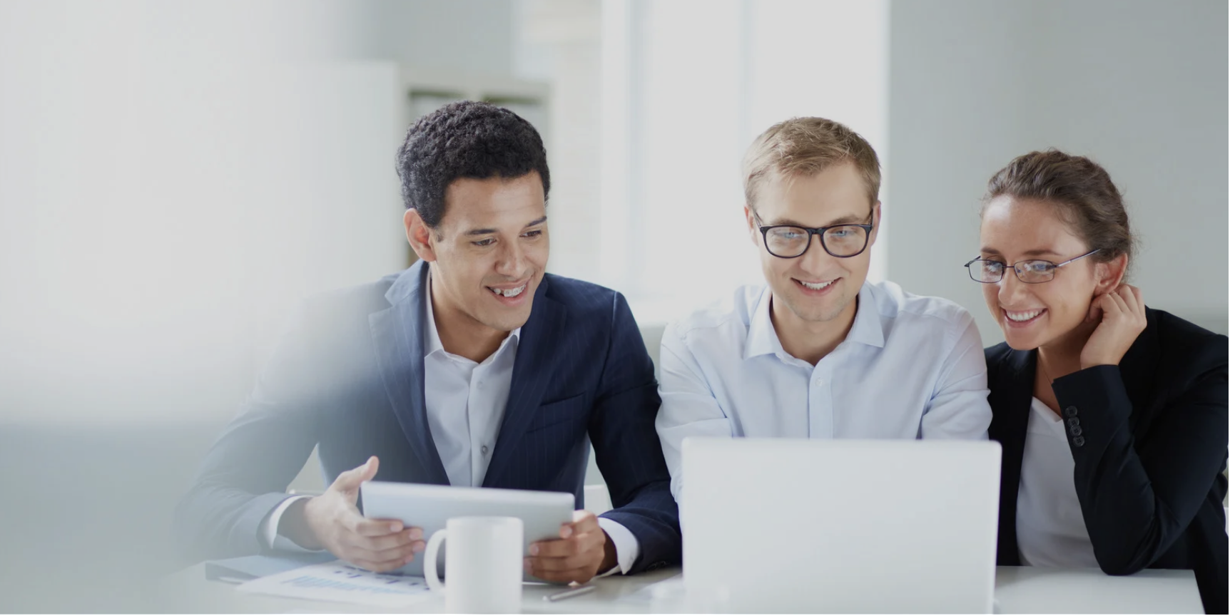 People working with ipad and laptop